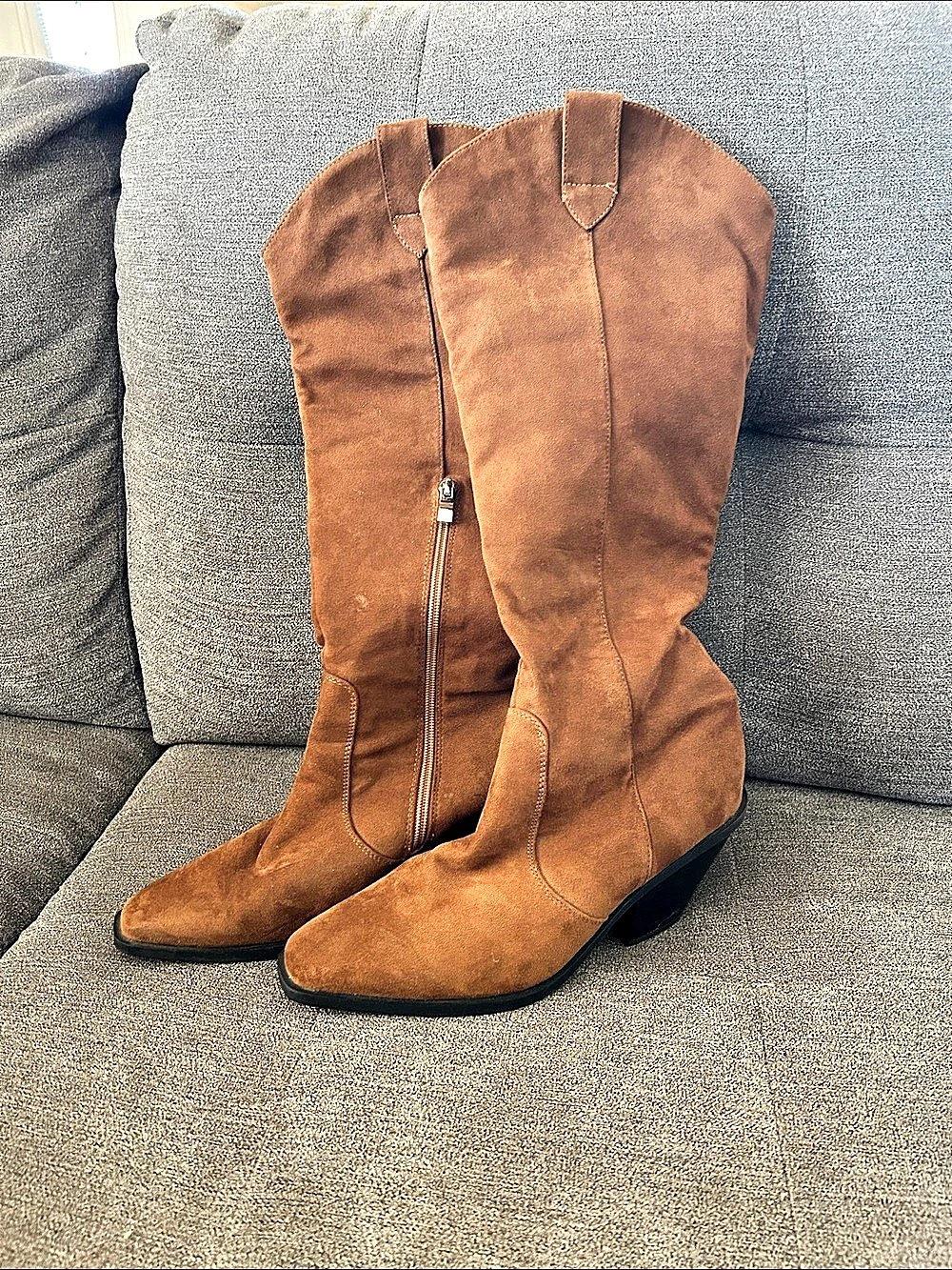 Brown knee high heeled boots